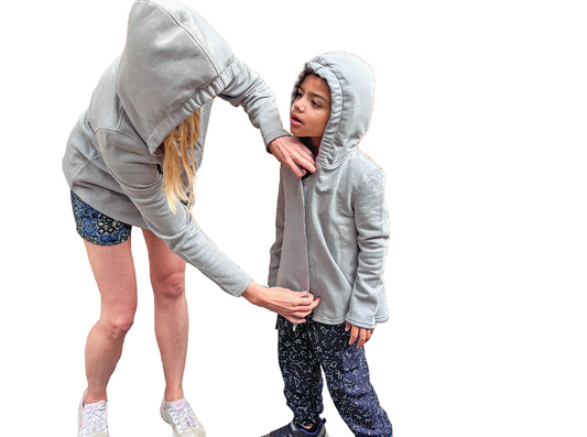 Sound reducing sensory hoodies on adult and autistic child.