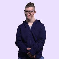 Man with disabilities in our adaptive sensory hoodie with zipper part way down.
