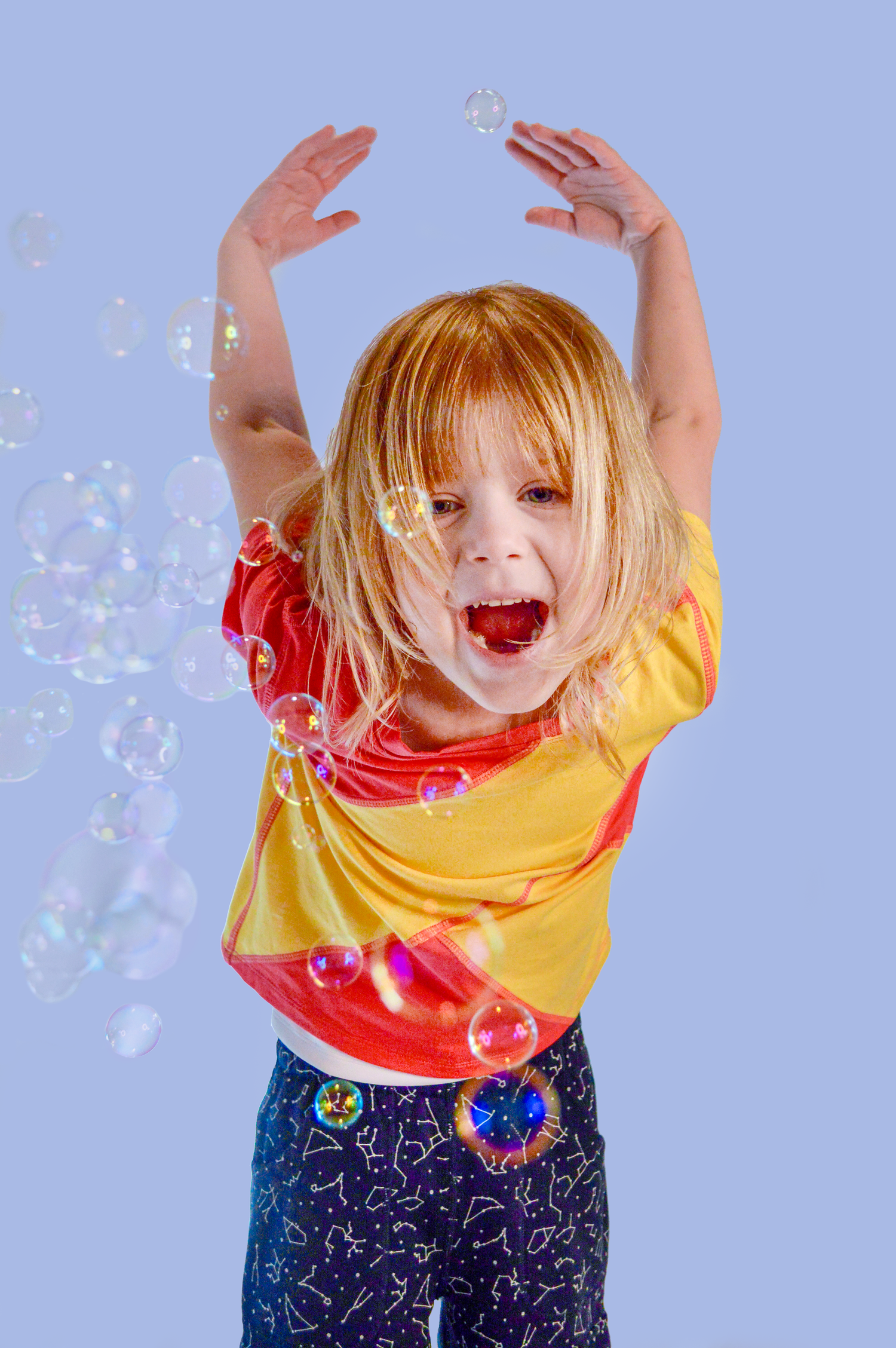 Autistic child in sensory friendly joggers and compression tee happy stimming with bubbles!